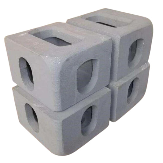 Four ISO Corner Castings from Container Nut are neatly stacked in an alternating pattern. Each casting has a hole in the center.