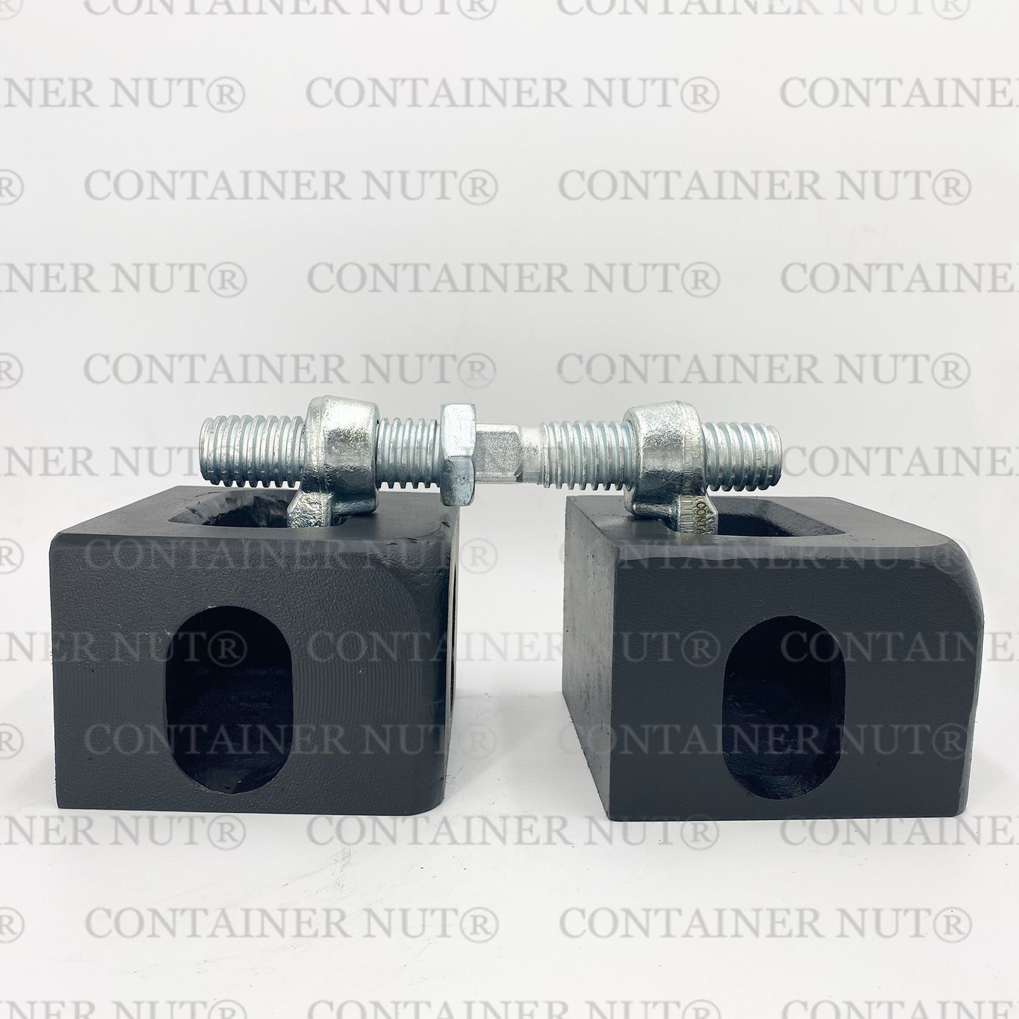 Bridge Fitting demo image. Two silver rectangular blocks with holes and threaded bolts secured with nuts placed on top, resembling bridge fittings, set against a grey background with "Container Nut®" repeatedly printed in grey.