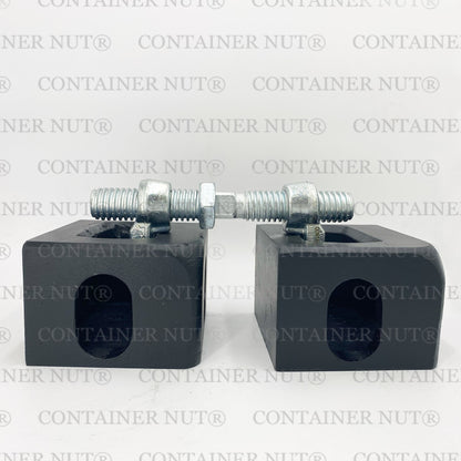 Bridge Fitting demo image. Two silver rectangular blocks with holes and threaded bolts secured with nuts placed on top, resembling bridge fittings, set against a grey background with "Container Nut®" repeatedly printed in grey.