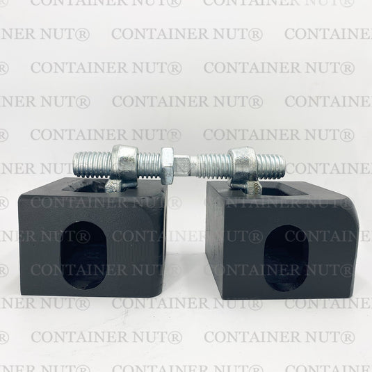 Bridge Fitting demo image. Two silver rectangular blocks with holes and threaded bolts secured with nuts placed on top, resembling bridge fittings, set against a grey background with "Container Nut®" repeatedly printed in grey.